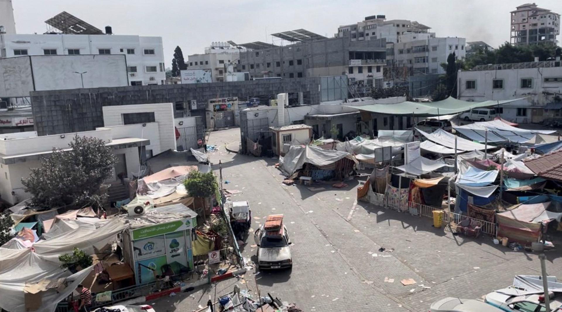 Displaced Palestinians shelter in tents at the yard outside Al-Shifa while Israeli forces invade the hospital. 