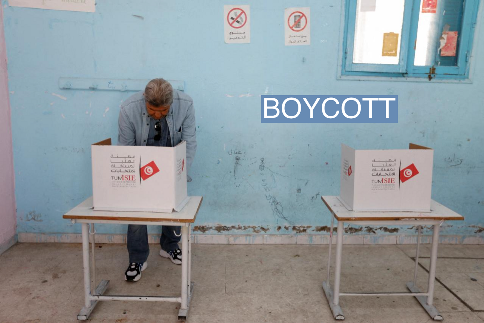 A man votes at a polling station during parliamentary election in Tunis, Tunisia December 17, 2022.