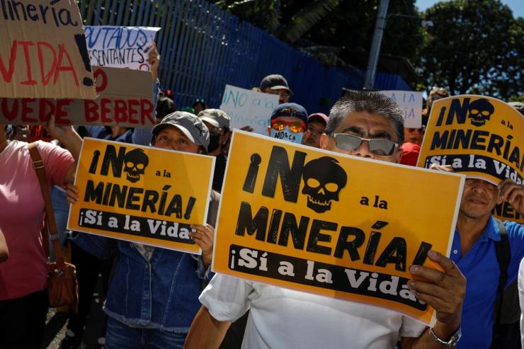People take part in a protest in San Salvador over the national ban on metals mining in San Salvador, El Salvador.