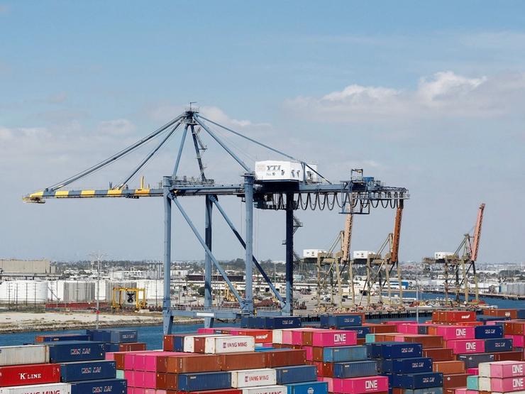 Shipping containers are stacked at a terminal at the port of Los Angeles.