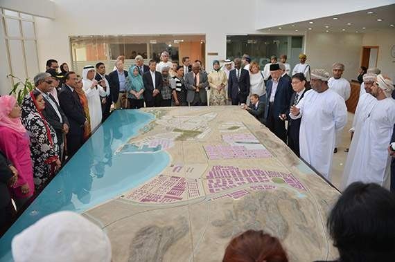 An international delegation is shown a model of Duqm’s development plans. 