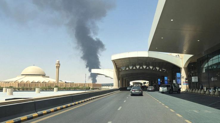 Large plume of black smoke rises from the fuel storage area at King Khalid International Airport