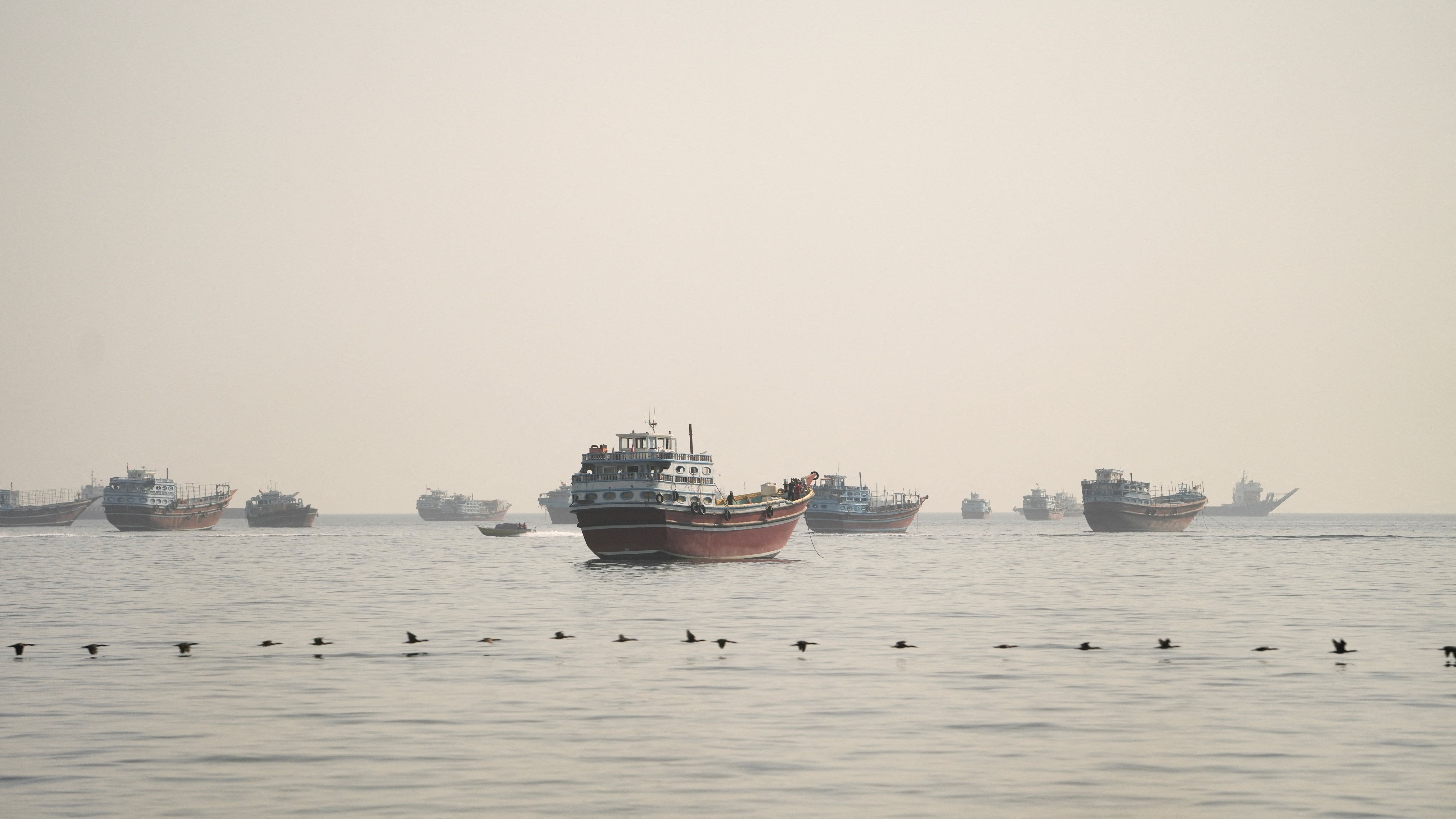 Vessels are anchored in the Strait of Hormuz as seen from Musandam.
