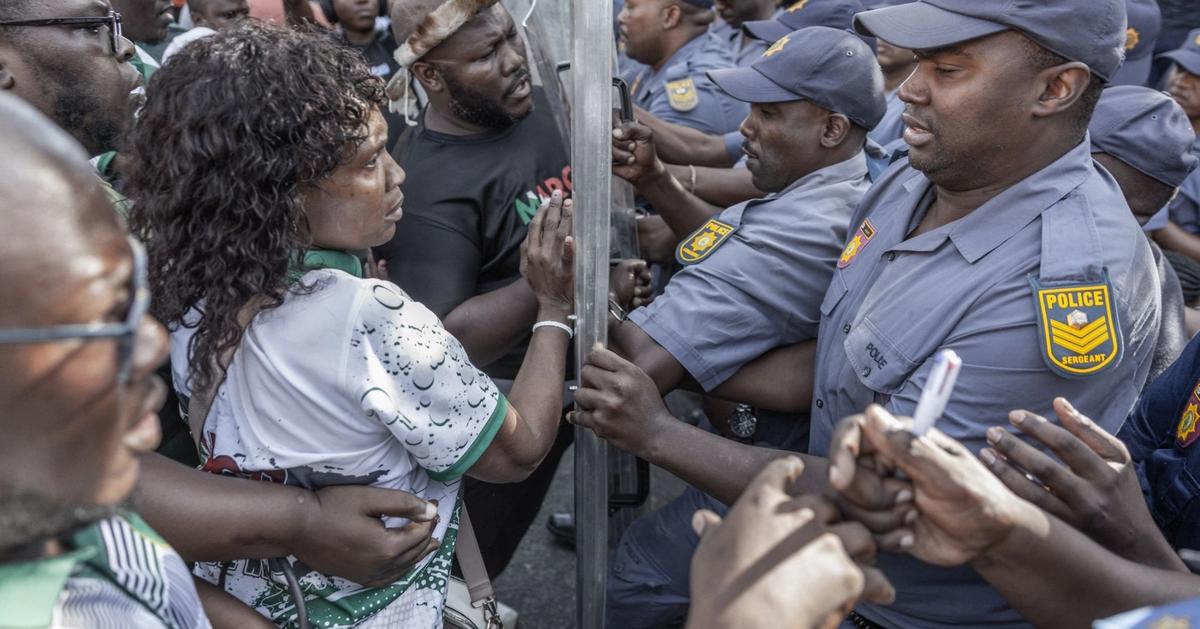 South Africa police clash with displaced migrants