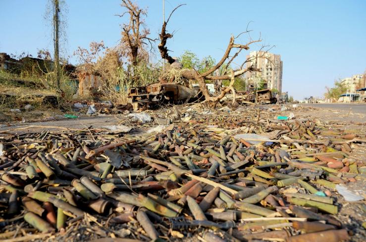 Unexploded ordnance lie on the ground on a street in Khartoum.
