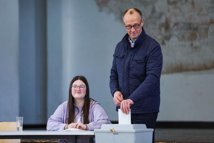 German conservative candidate for chancellor and Christian Democratic Union (CDU) party leader Friedrich Merz votes during the 2025 general election.