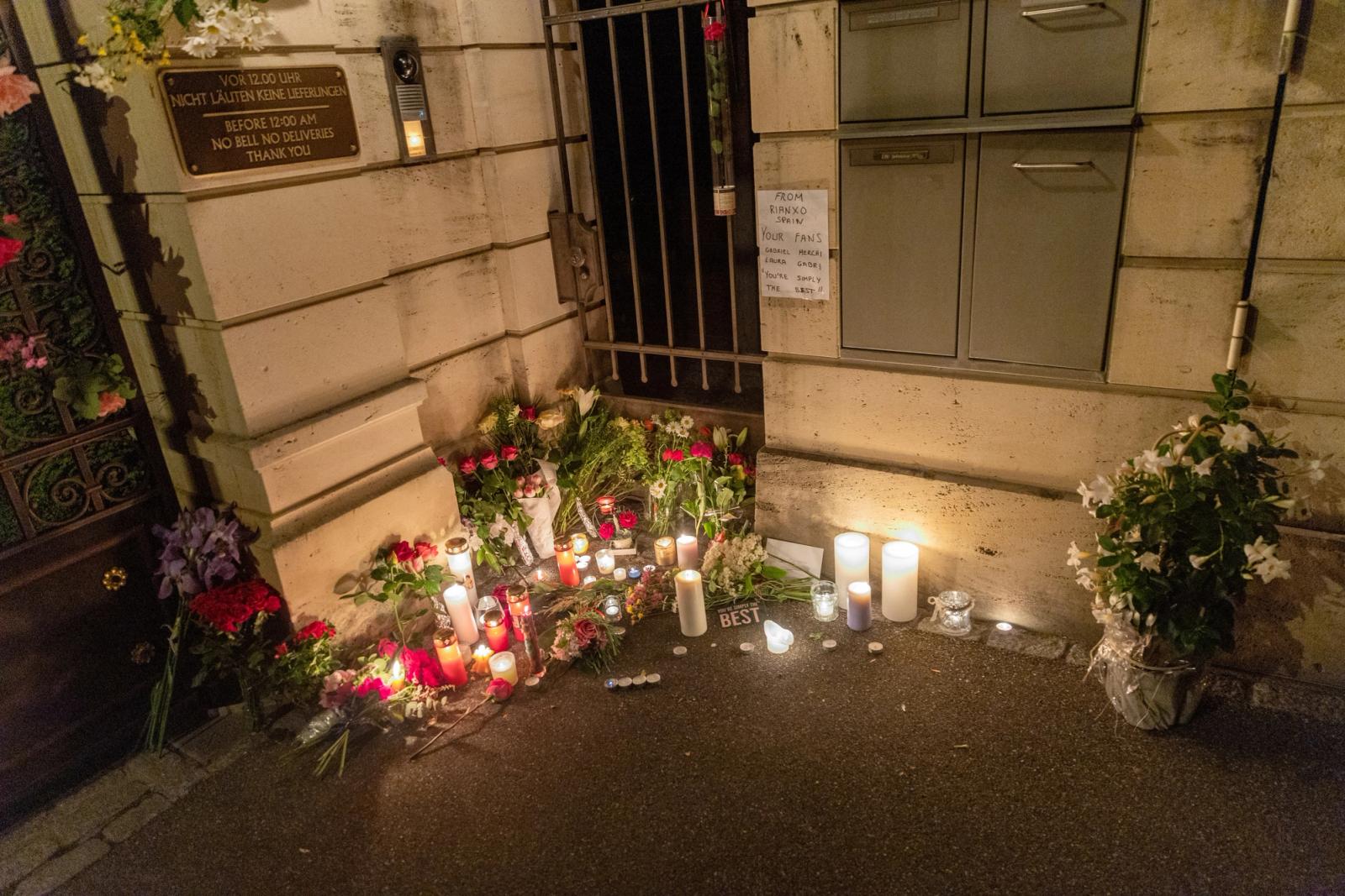 Flowers and candles outside Turner's home.