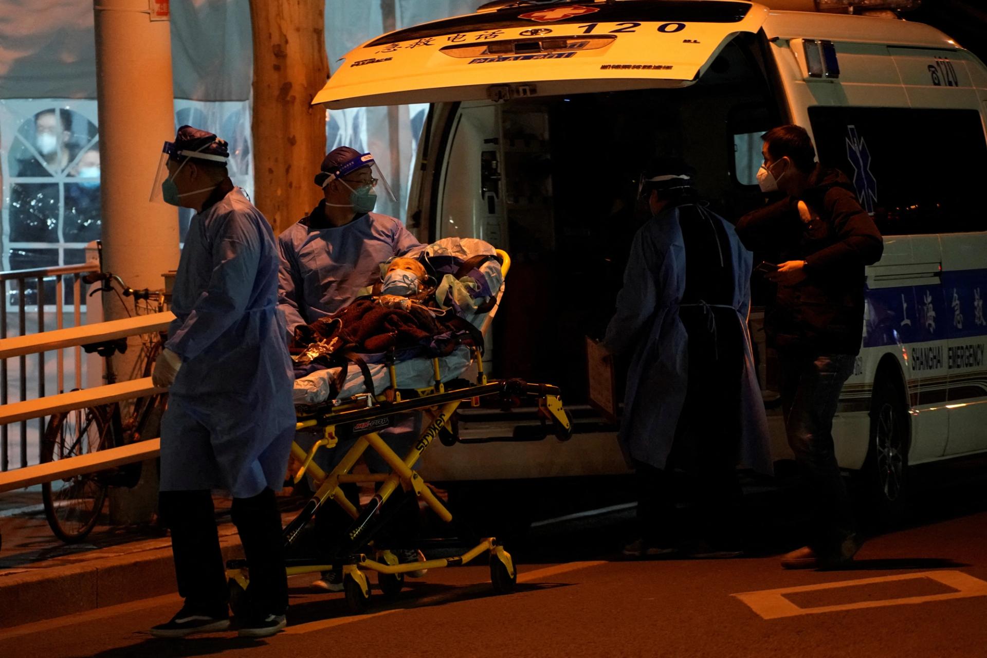 Medical staff moves a patient into a fever clinic at a hospital, as coronavirus disease (COVID-19) outbreaks continue in Shanghai, China.