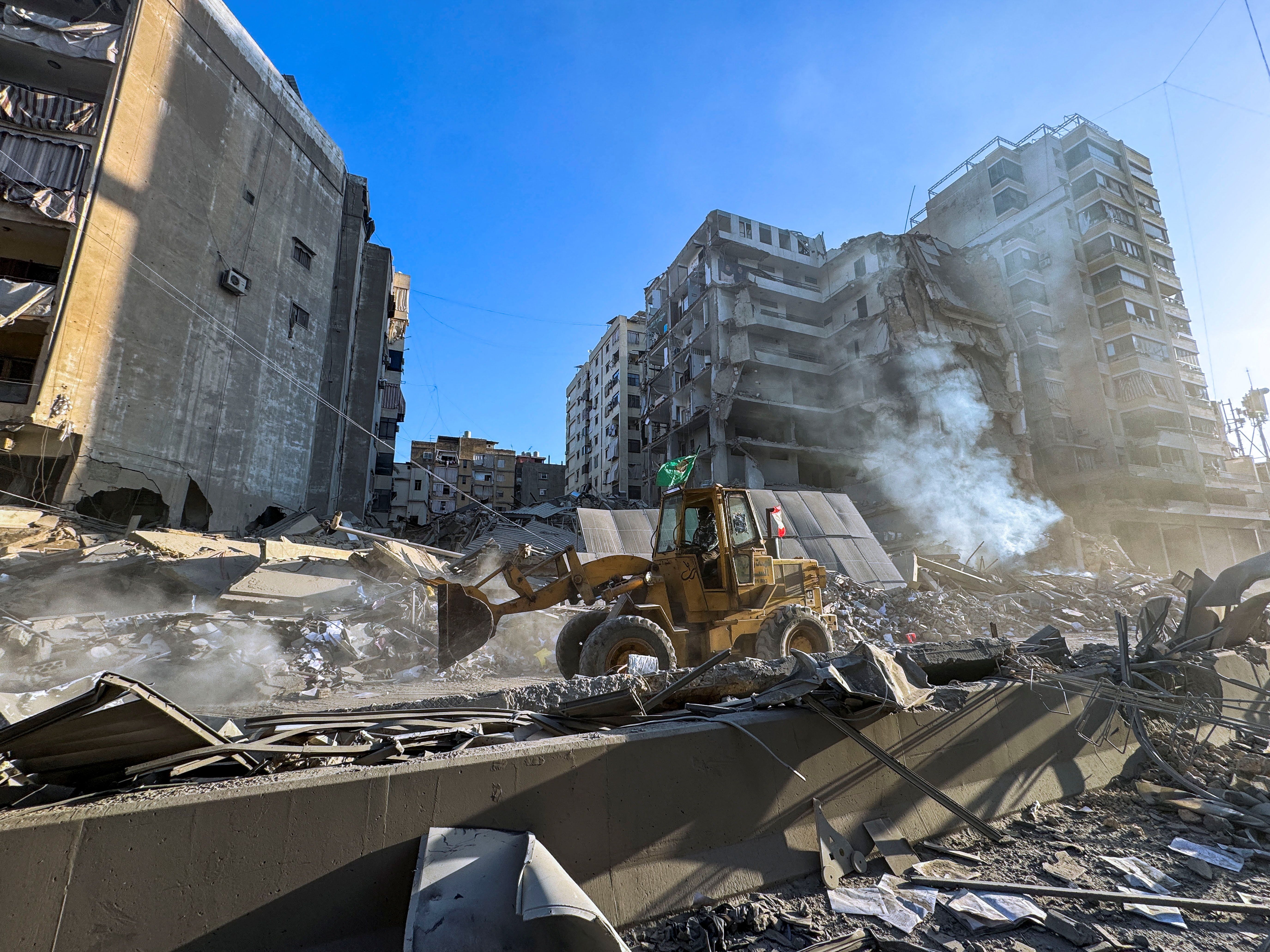 A bulldozer drives along a damaged street amid destruction after an Israeli strike on Beirut’s southern suburbs, following renewed hostilities between Hezbollah and Israel amid the U.S.-Israeli conflict with Iran, Lebanon, in Beirut