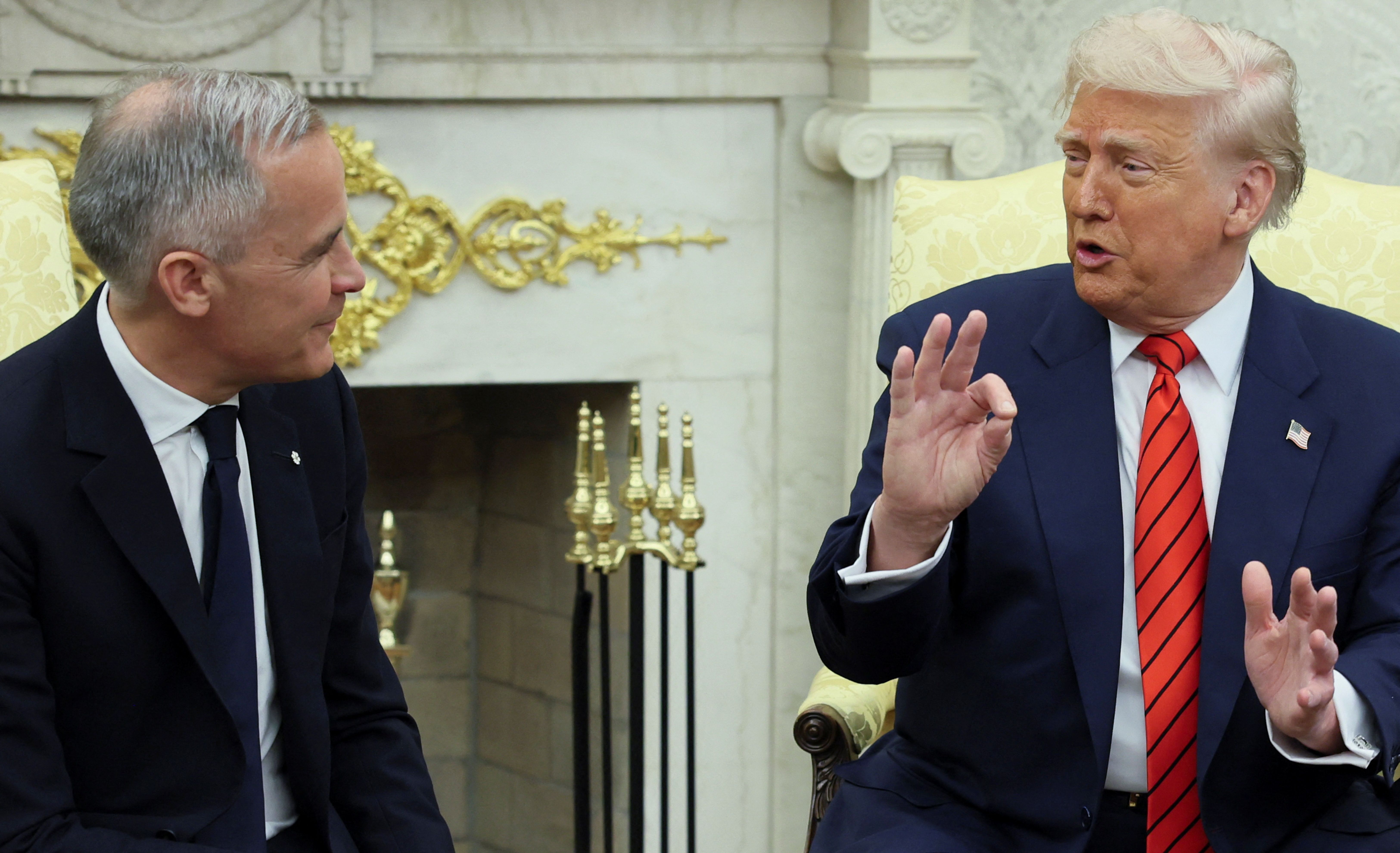 U.S. President Donald Trump gestures during a meeting with Canadian Prime Minister Mark Carney in the Oval Office at the White House in Washington, D.C., U.S.
