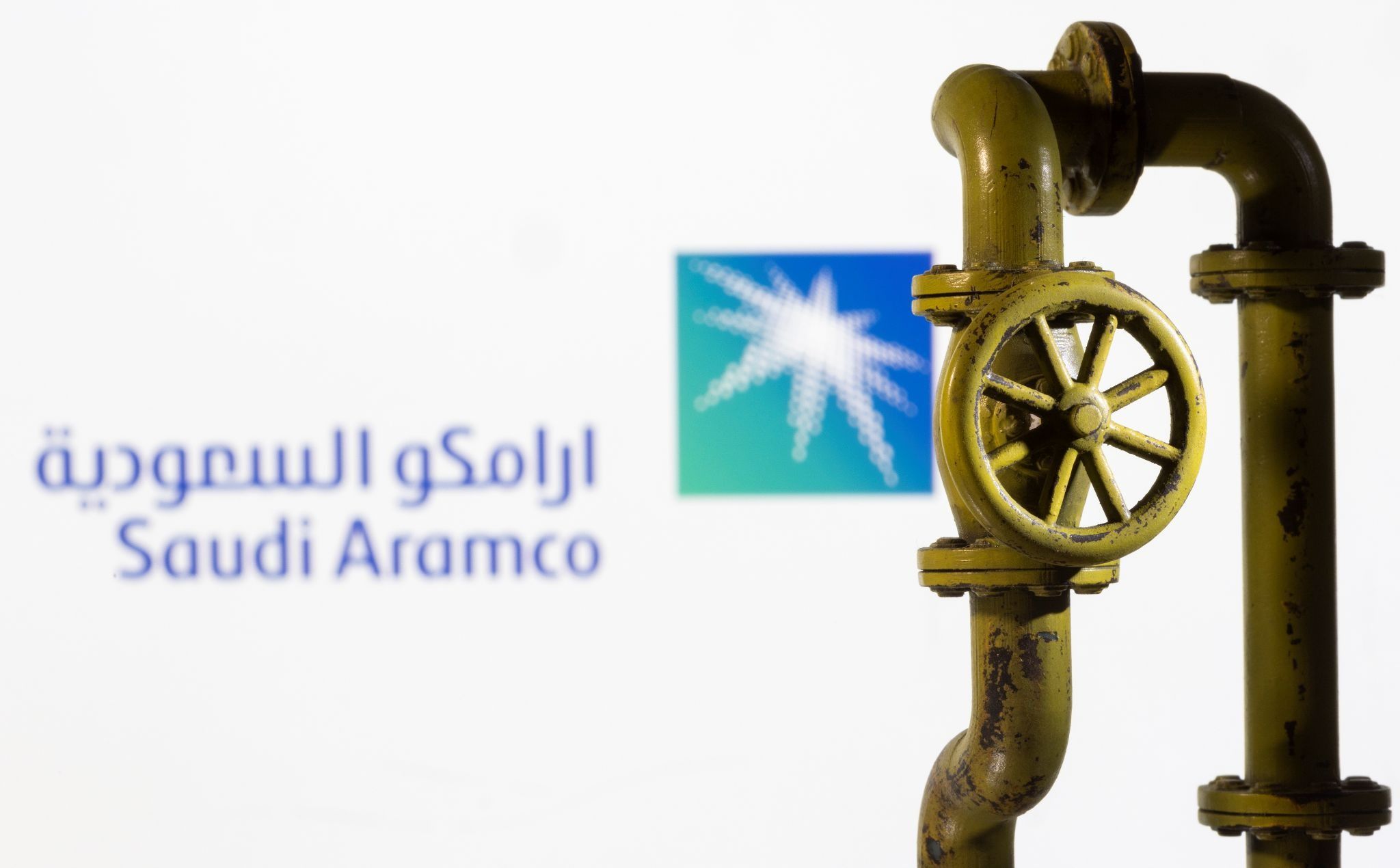 A 3D printed natural gas pipeline is placed in front of displayed Saudi Aramco logo in this illustration taken February 8, 2022
