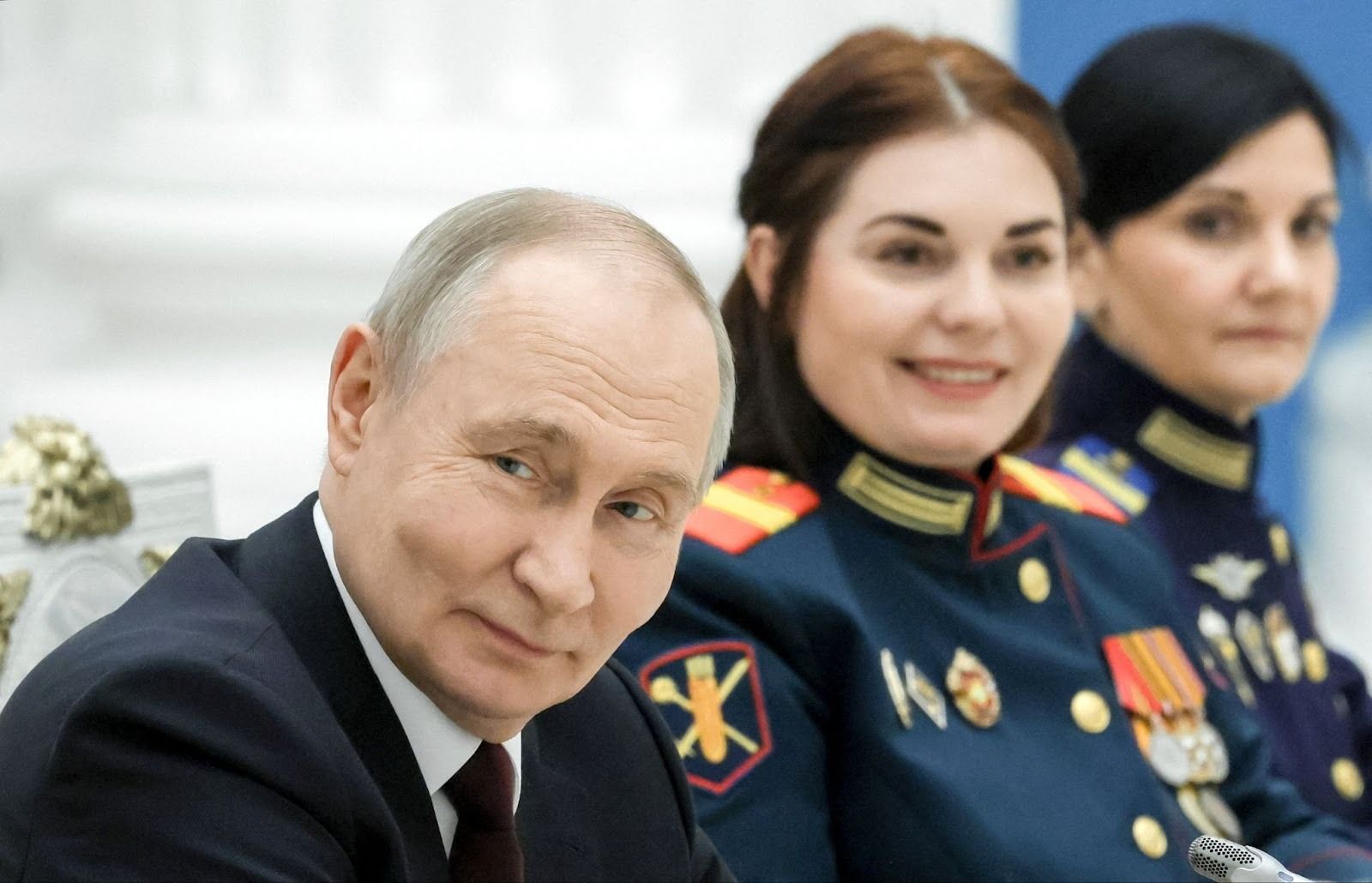 Putin with military members.  