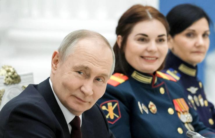 Putin with military members.