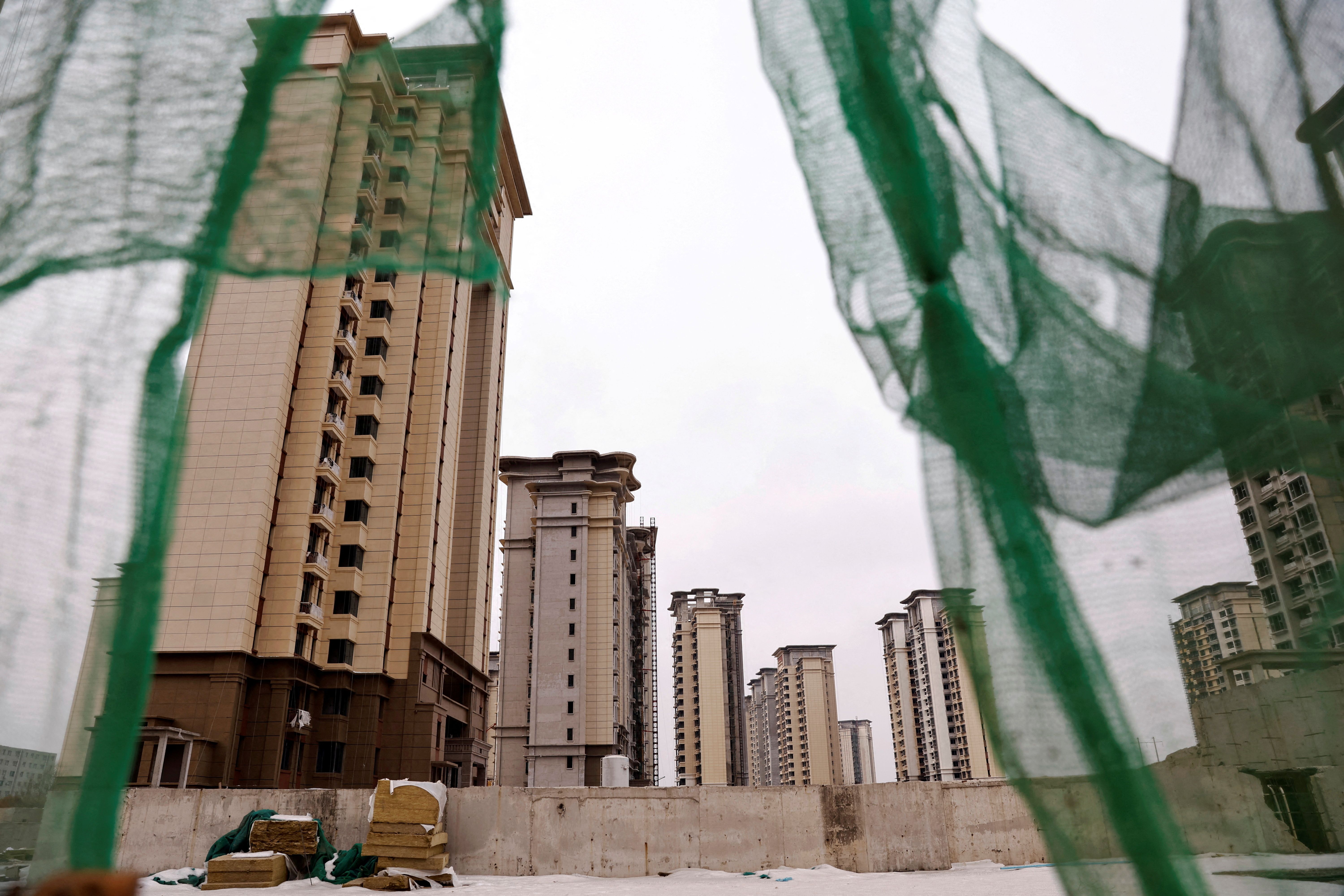FILE PHOTO: A view of unfinished residential buildings developed by China Evergrande Group in the outskirts of Shijiazhuang, Hebei province, China February 1, 2024. REUTERS/Tingshu Wang/File Photo