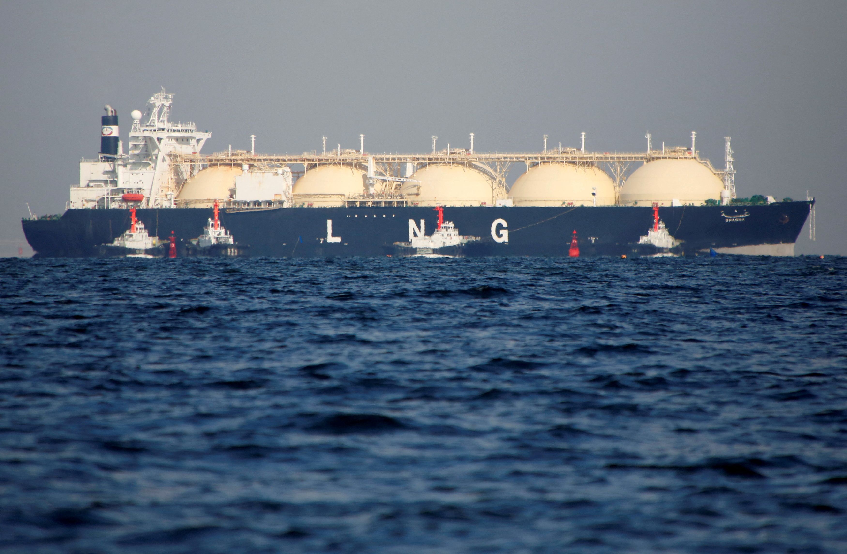 A liquefied natural gas (LNG) tanker is tugged towards a thermal power station in Futtsu, east of Tokyo, Japan