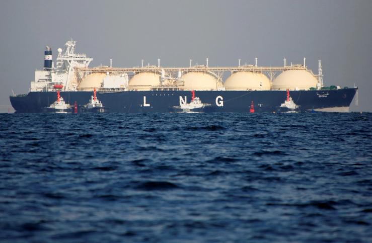 A liquefied natural gas (LNG) tanker is tugged towards a thermal power station in Futtsu, east of Tokyo, Japan