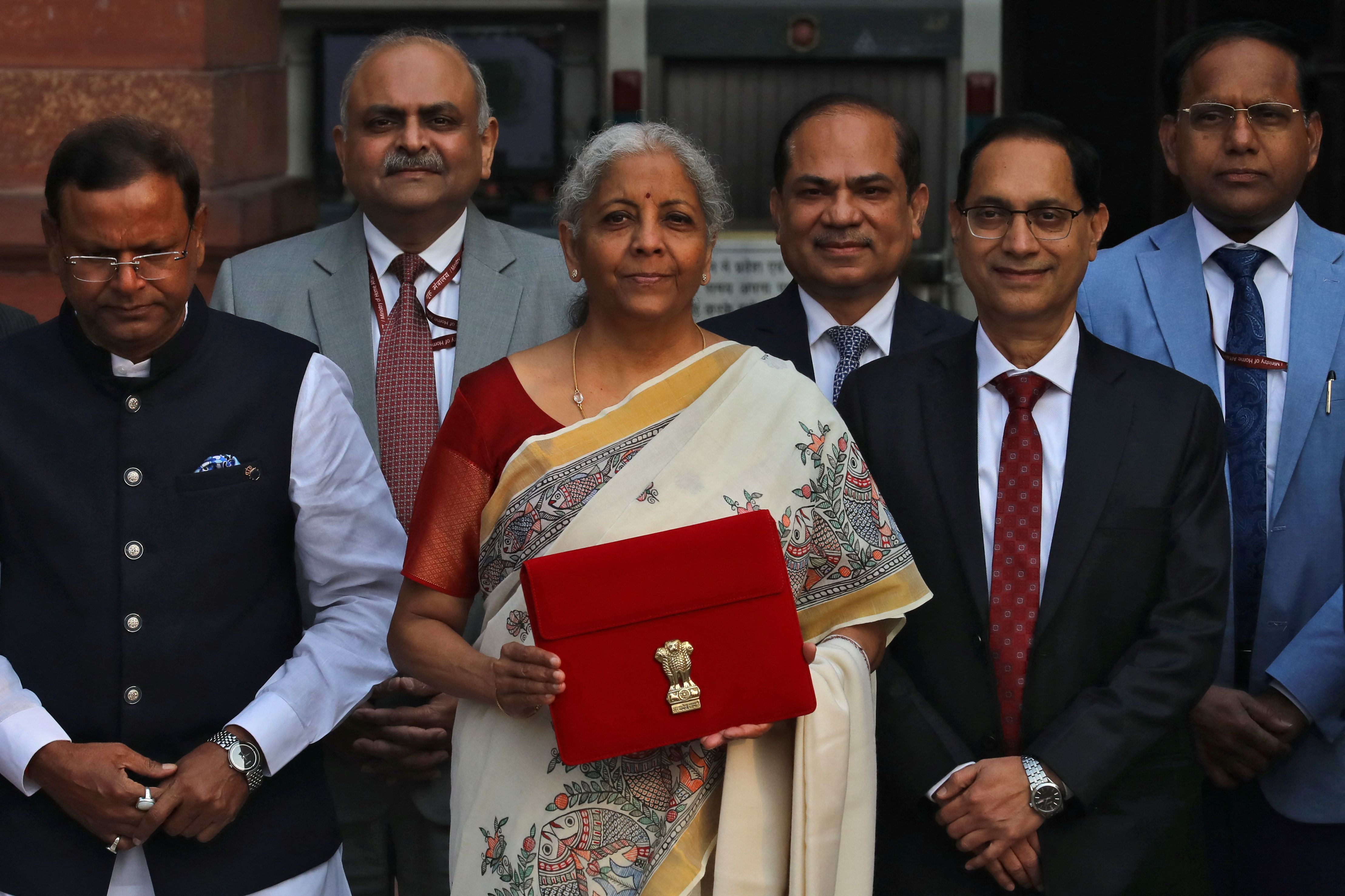 India’s Finance Minister Nirmala Sitharaman holds a folder with the Government of India’s logo.