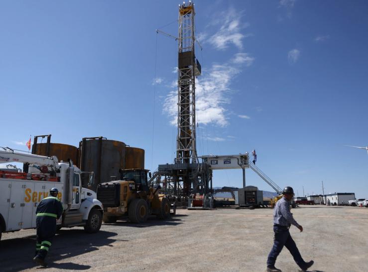 Drillers work on an electric powered drilling platform at the Cape Station geothermal project in Milford/