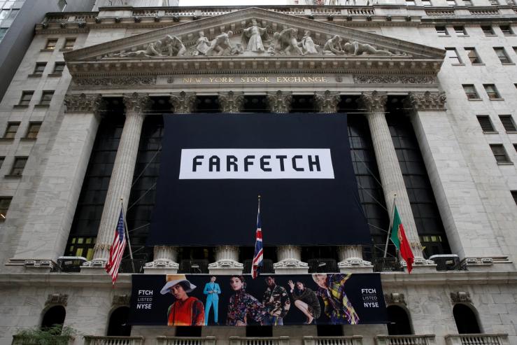 A banner to celebrate the IPO of online fashion house Farfetch is displayed on the facade of the of the New York Stock Exchange (NYSE) in New York, U.S., September 21, 2018.
