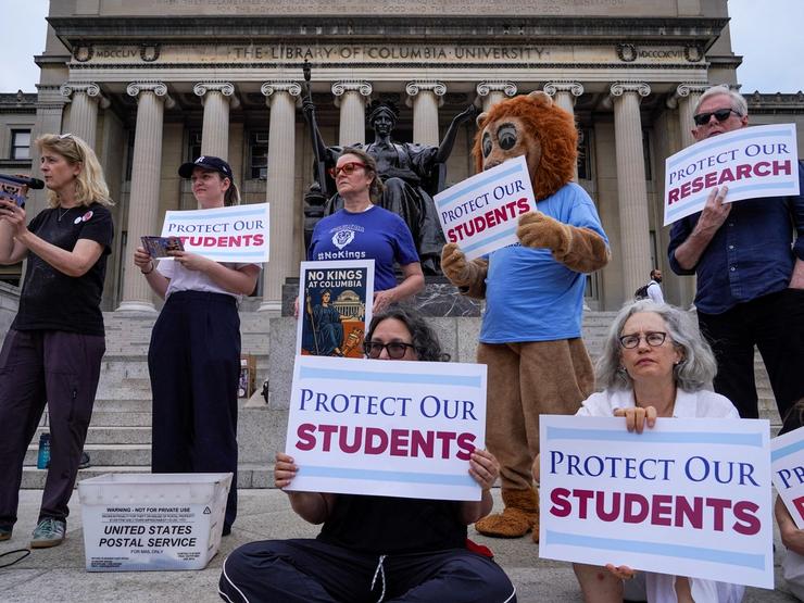Members of the Columbia faculty and staff protest against the university’s policies