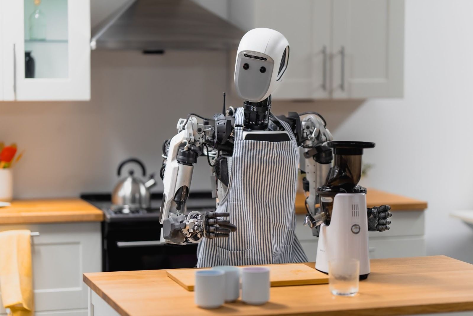 A humanoid robot in a kitchen.