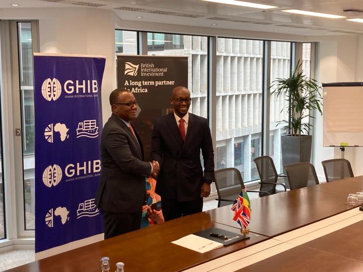 A photo of the deal signing ceremony.