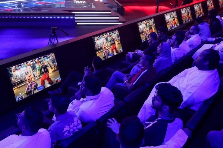 Spectators watch video games as gamers from different countries play during an esports and gaming festival Gamers8 at Boulevard Riyadh.