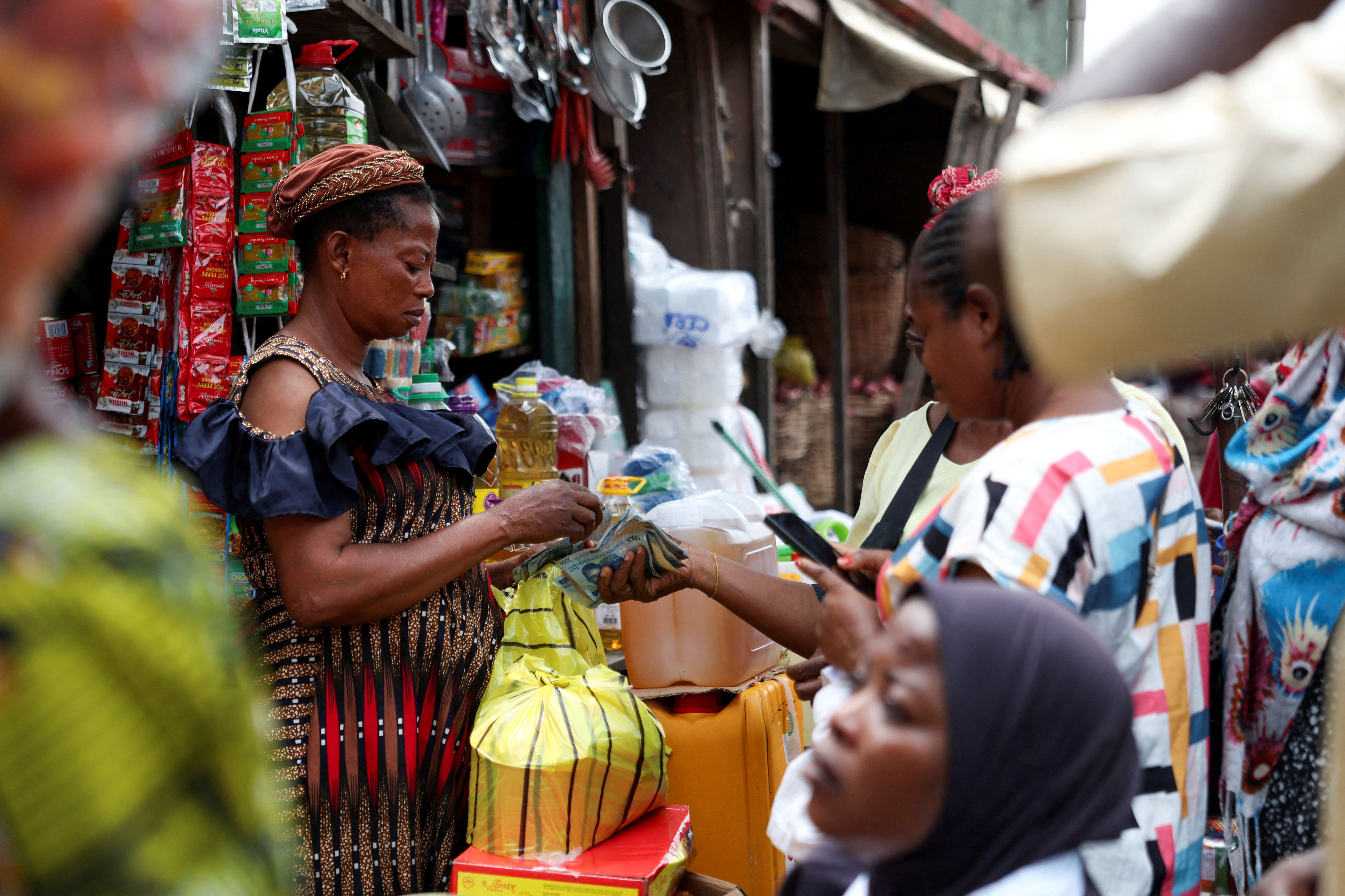 Traders transact at the Mile 12 Market ahead of Muslims festival of sacrifice (Eid Al-Adha) on Ikorodu road in Lagos, Nigeria, June 4, 2025.