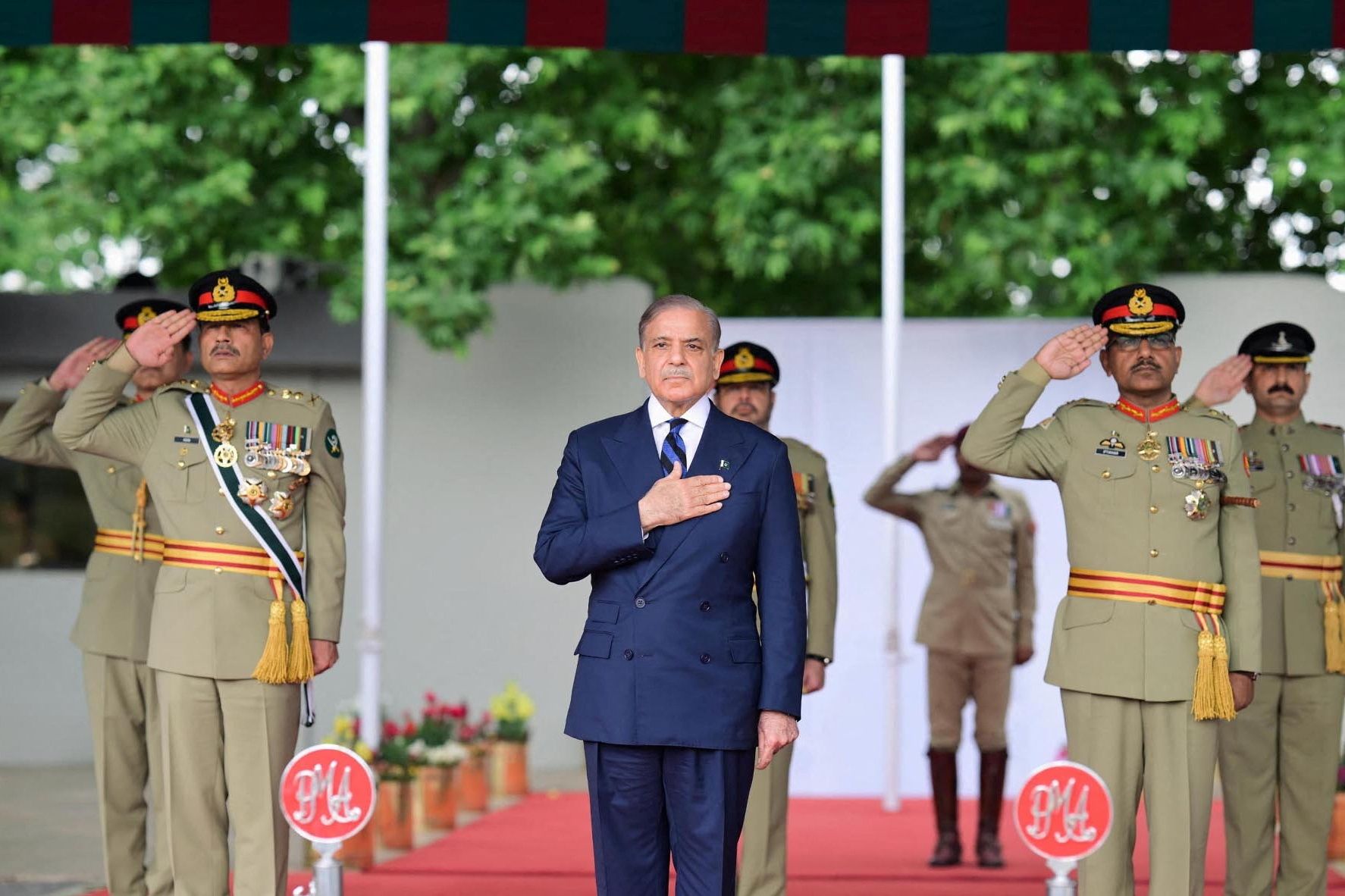 Pakistan’s Prime Minister Shehbaz Sharif, along with Chief of the Army Staff (COAS) of Pakistan Asim Munir, reviews the parade at the passing out ceremony of 151st Long Course at the Pakistan Military Academy (PMA) Kakul, Abbottabad