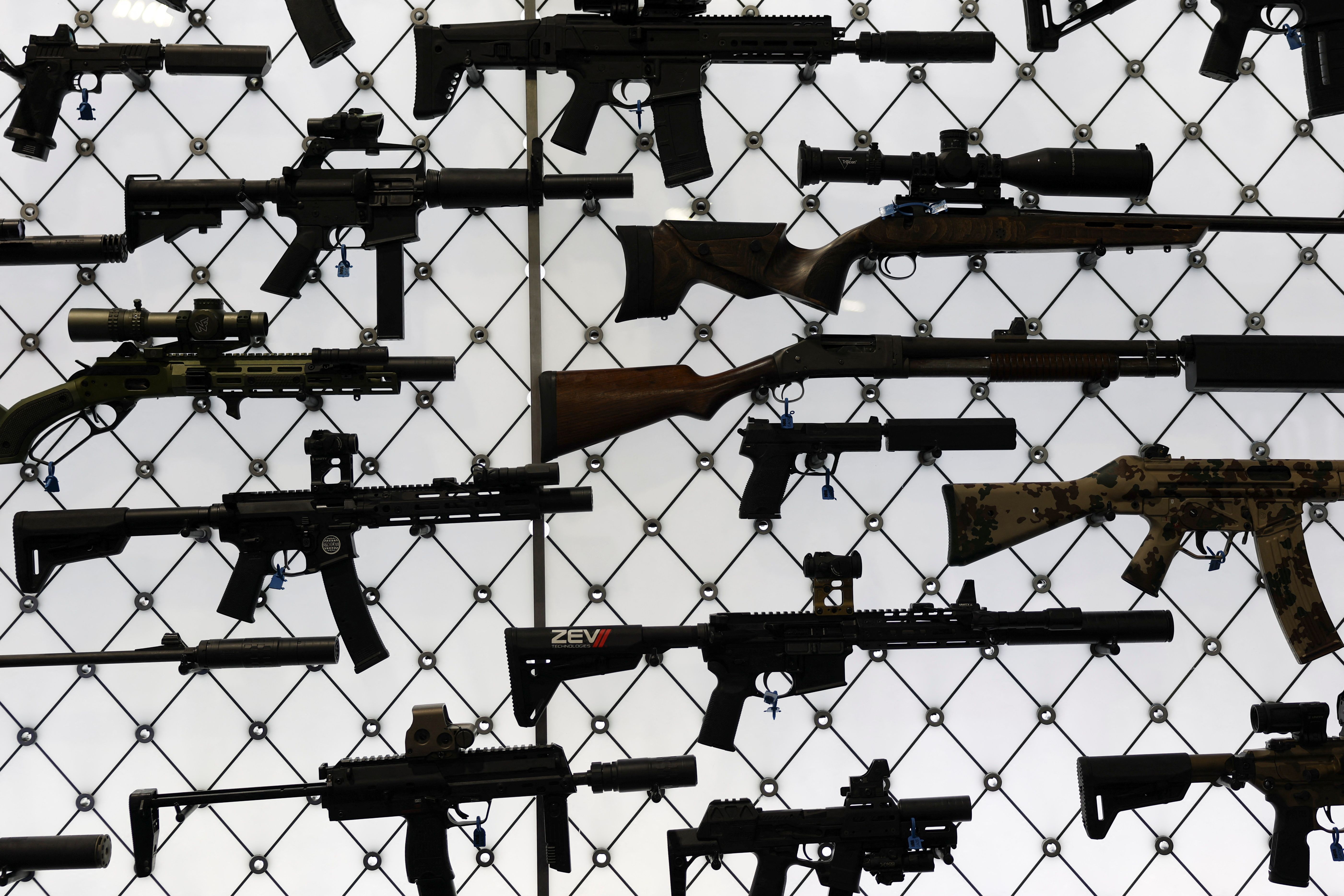 Two rifles lying on the ground. 