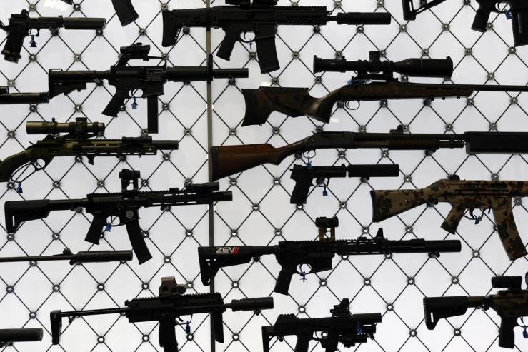 Two rifles lying on the ground.