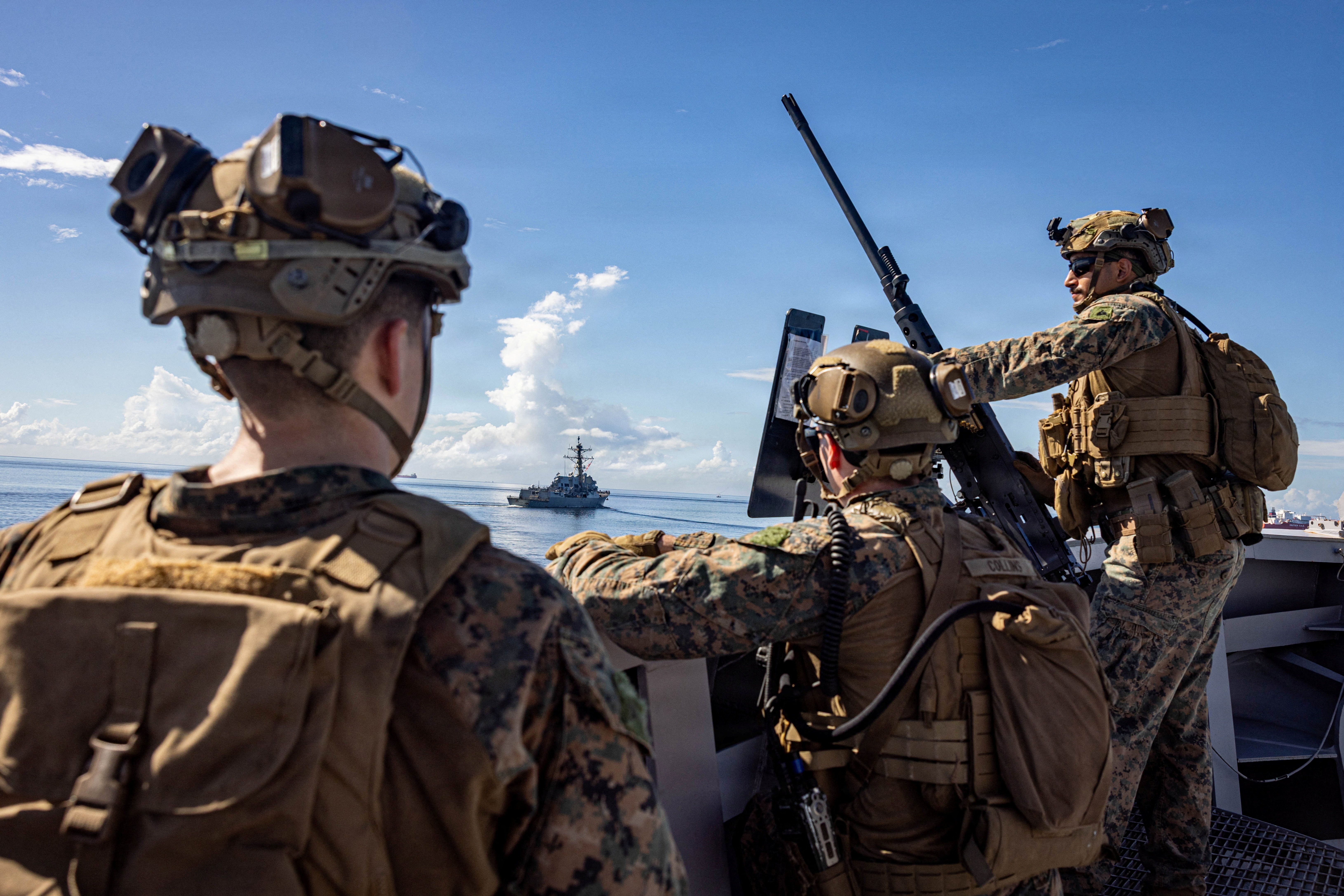 U.S. Marines keep watch during a strait transit while underway in the Caribbean Sea