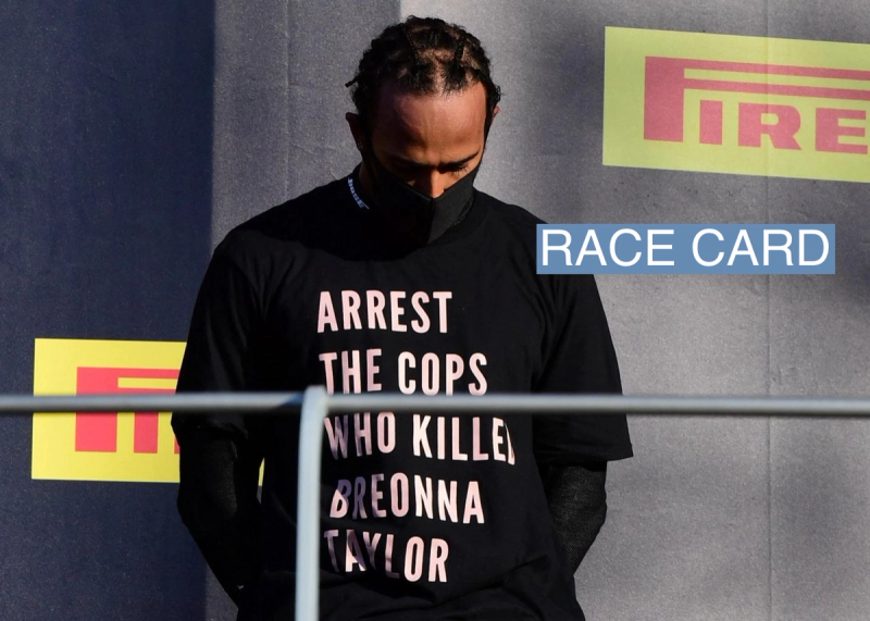 Lewis Hamilton wears a shirt in reference to Breonna Taylor on the podium as he celebrates after winning the race in Italy in 2020.