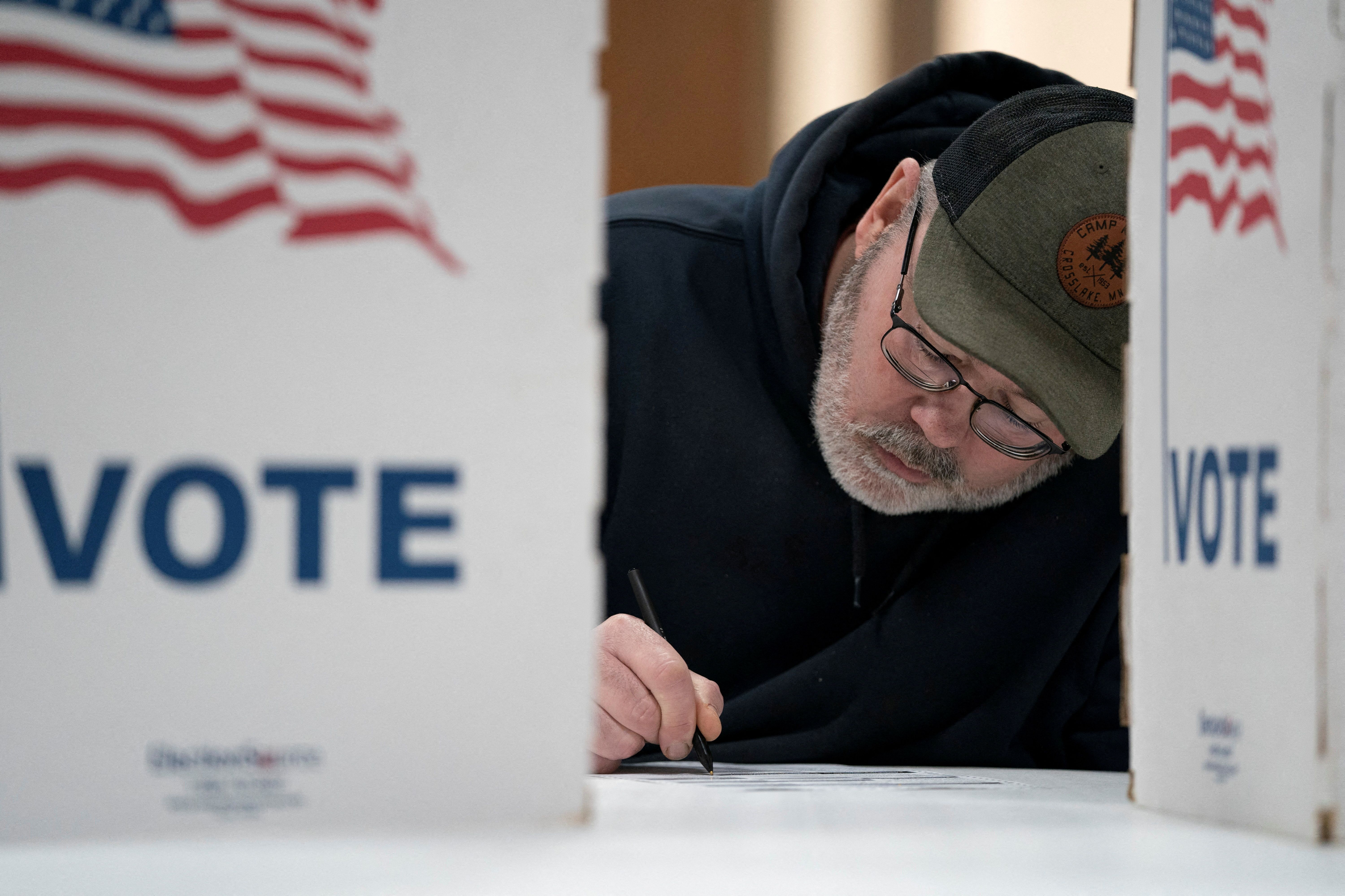 Wisconsin resident Cary Pallas prepares to vote in the Presidential Primary election at the Central Assembly of God church polling place in Douglas County in Superior, Wisconsin, U.S. April 2, 2024.