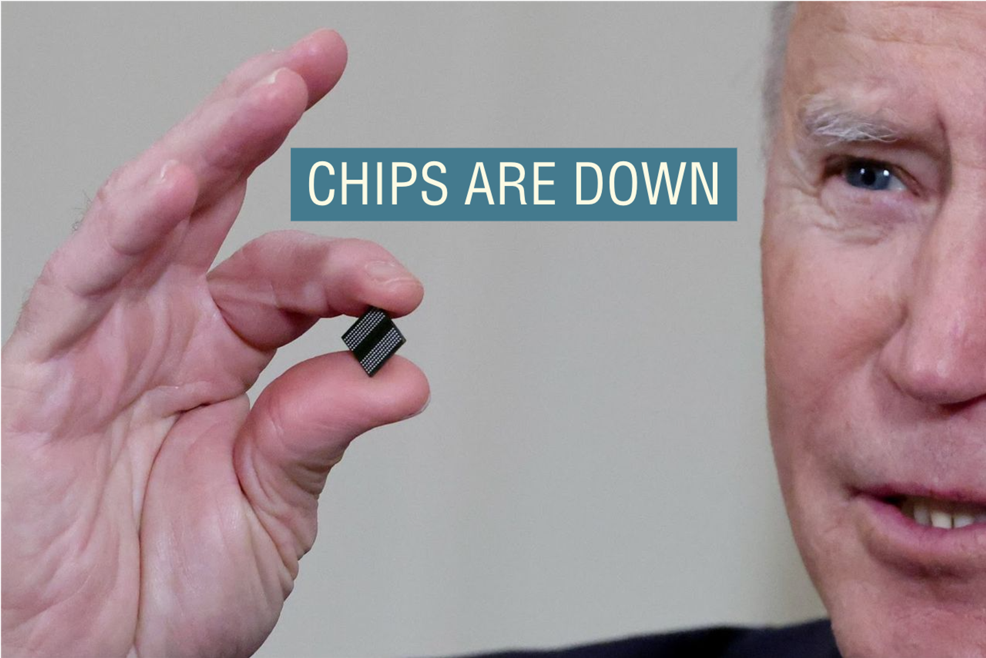 Joe Biden holds a semiconductor chip in 2021. 