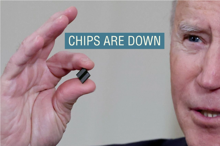 Joe Biden holds a semiconductor chip in 2021.