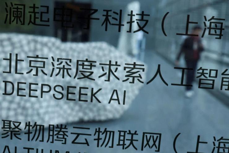 DeepSeek AI listed on office directory pasted on glass