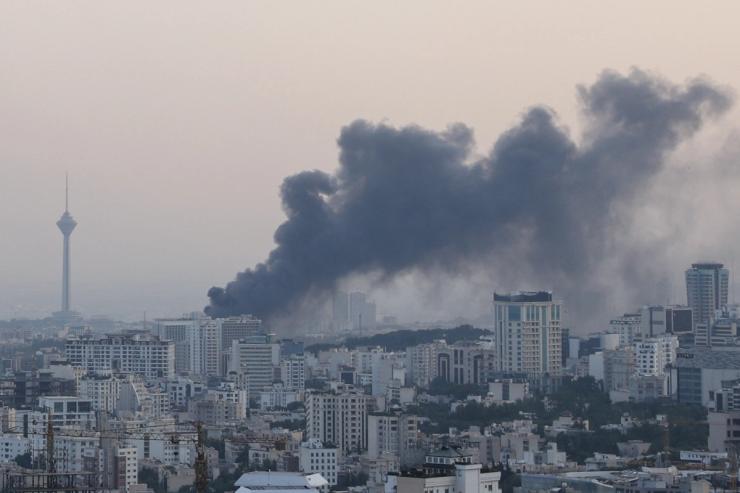 Smoke rises following an Israeli attack on the IRIB building.