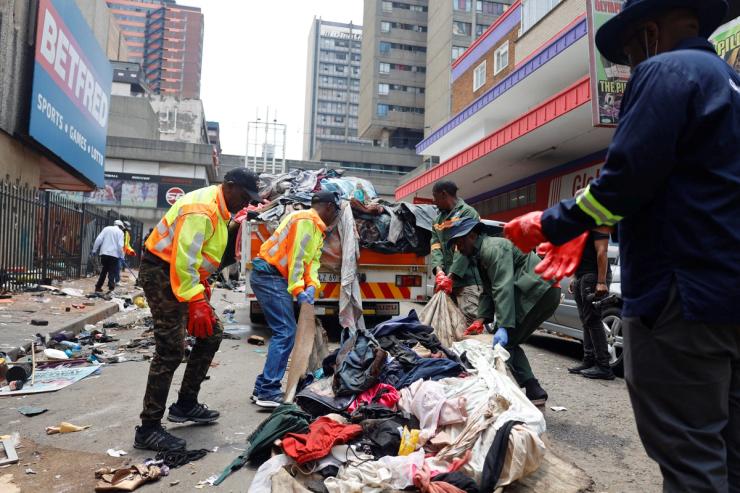 Johannesburg workers remove informal structures occupied by people living on the streets.