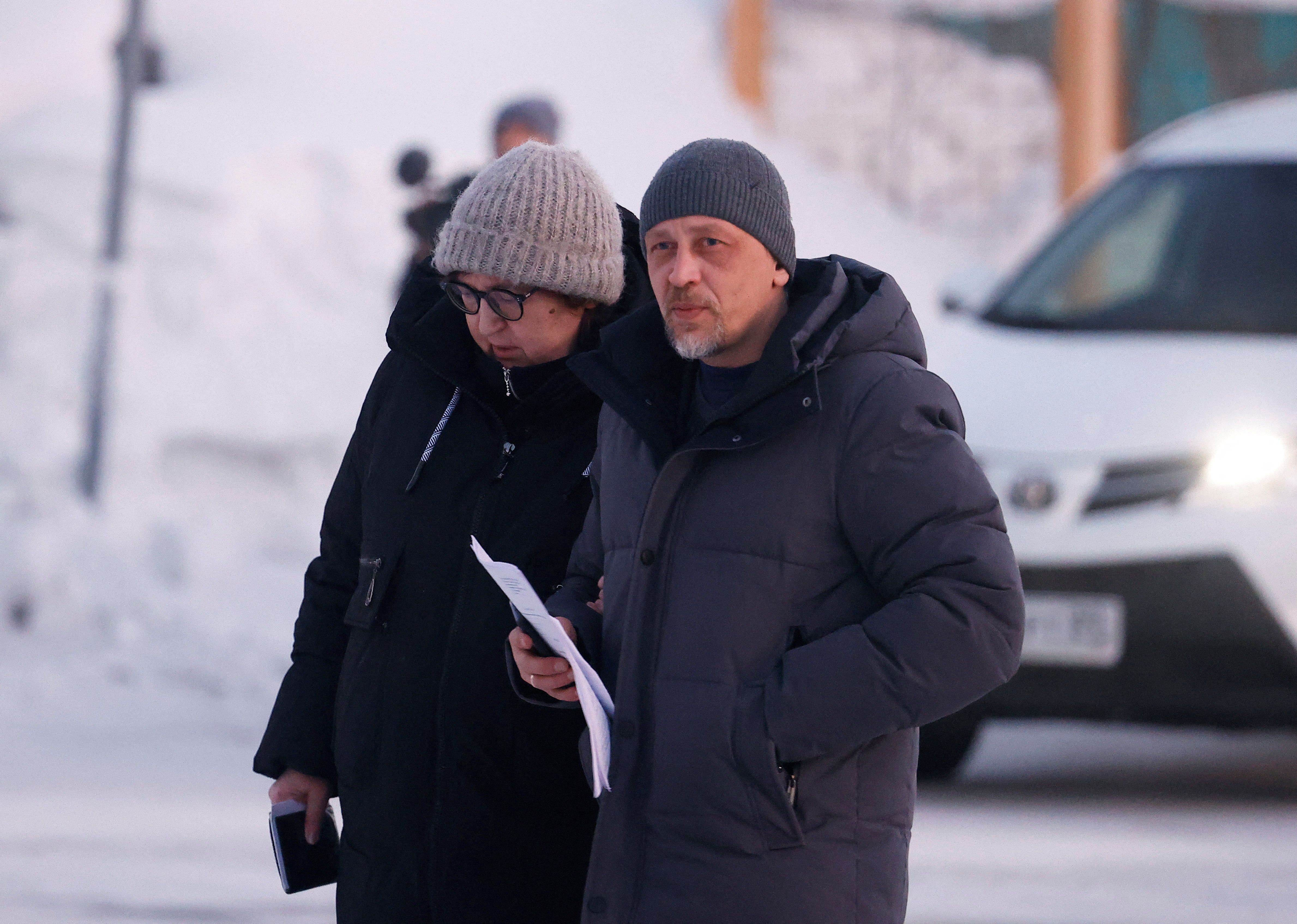 Lyudmila Navalnaya, the mother of late Russian opposition leader Alexei Navalny, and lawyer Vasily Dubkov arrive at the regional department of Russia’s Investigative Committee in the town of Salekhard on February 17.