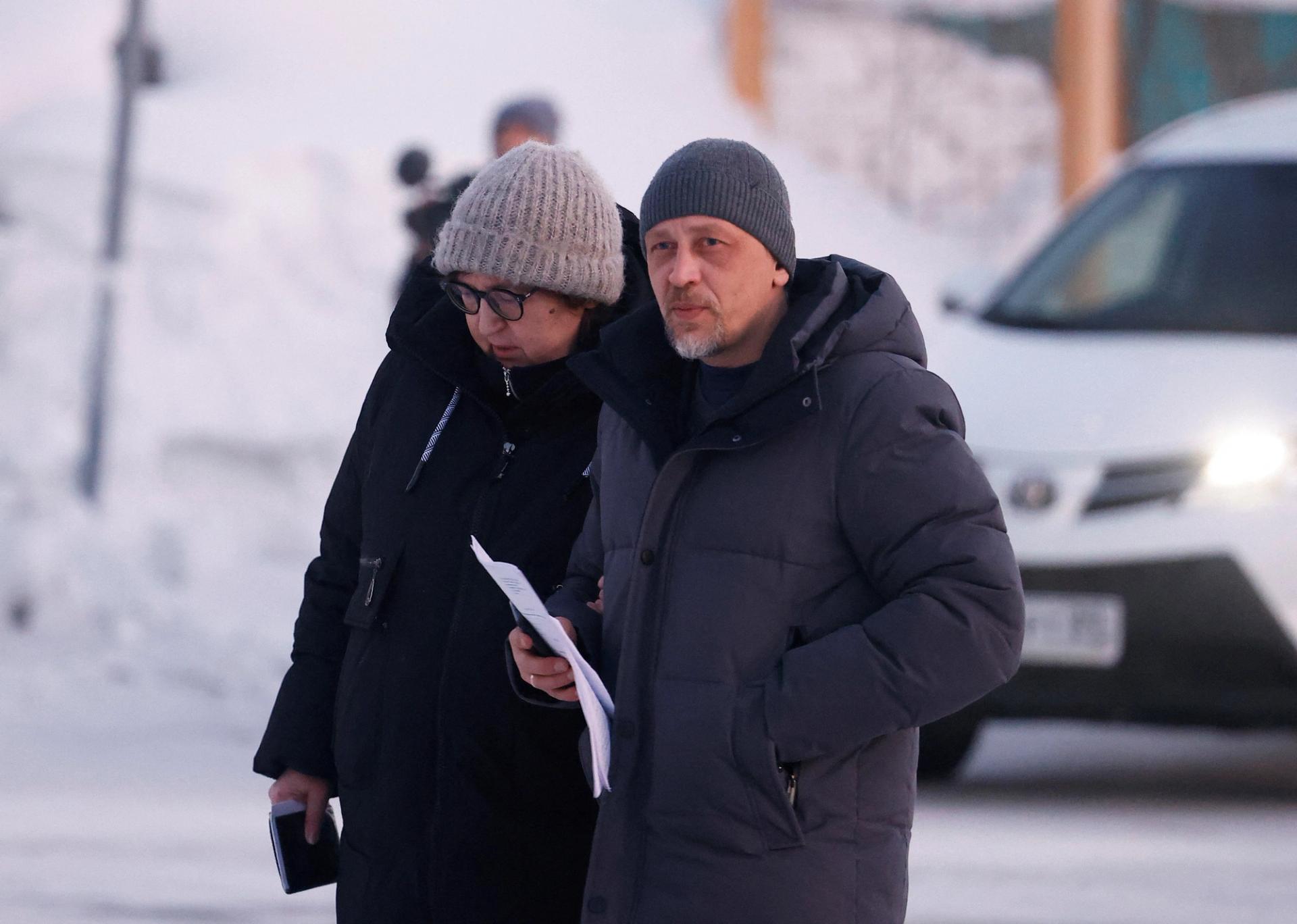 Lyudmila Navalnaya, the mother of late Russian opposition leader Alexei Navalny, and lawyer Vasily Dubkov arrive at the regional department of Russia's Investigative Committee in the town of Salekhard on February 17.