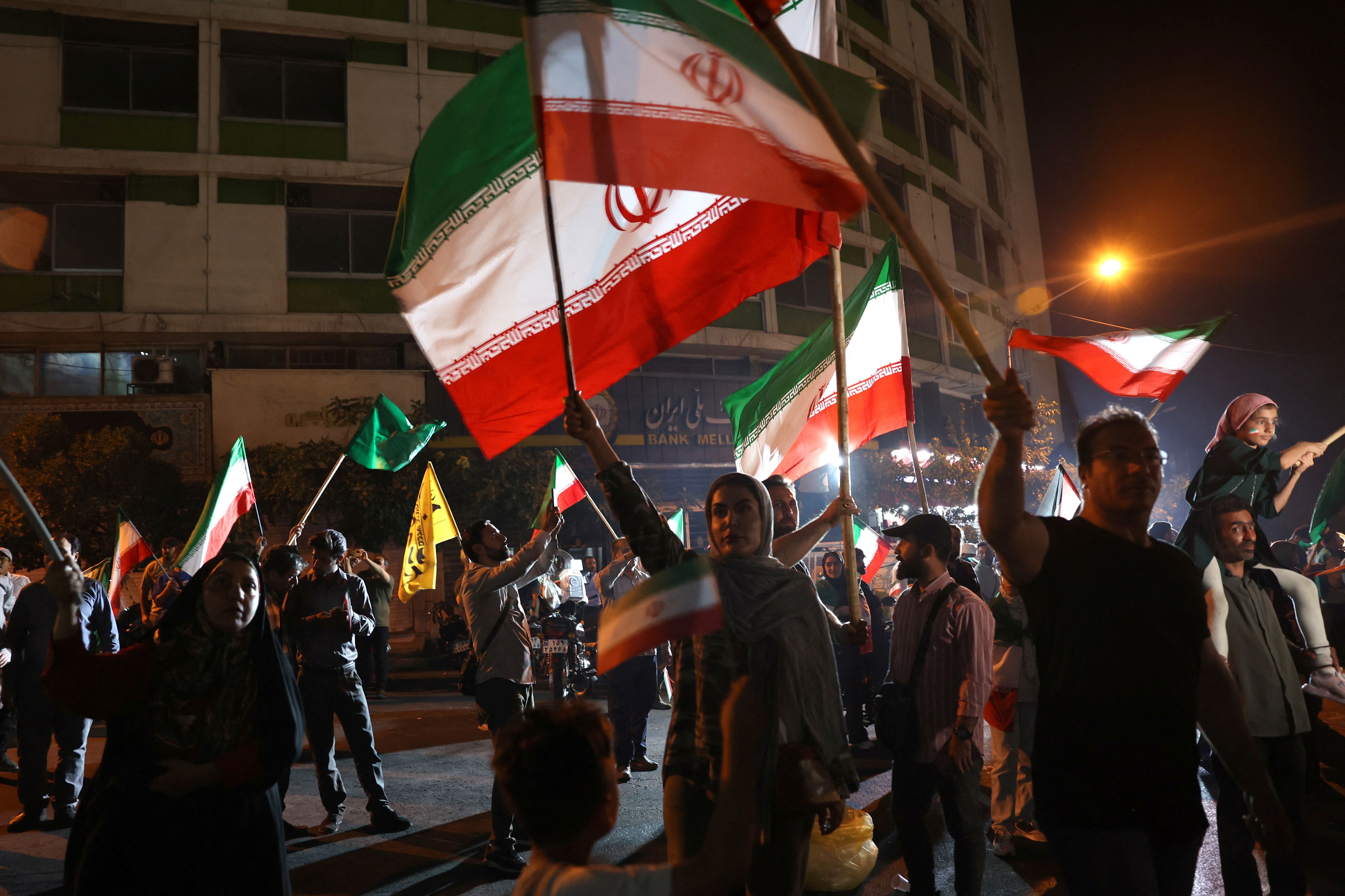  group of Iranians celebrate following Iran’s attack on US military base in Qatar, amid the Iran-Israel conflict, in Tehran.