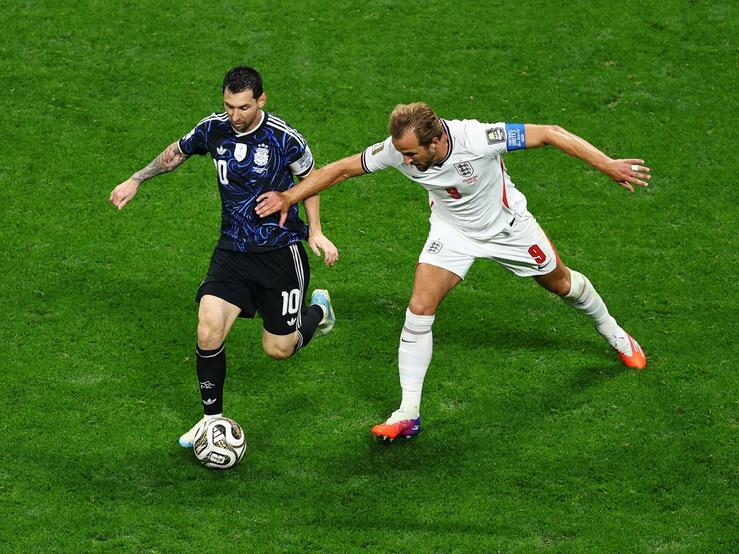 Argentina’s Lionel Messi in action with England’s Harry Kane