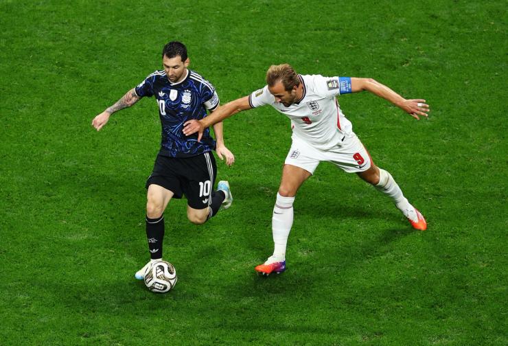 Argentina’s Lionel Messi in action with England’s Harry Kane