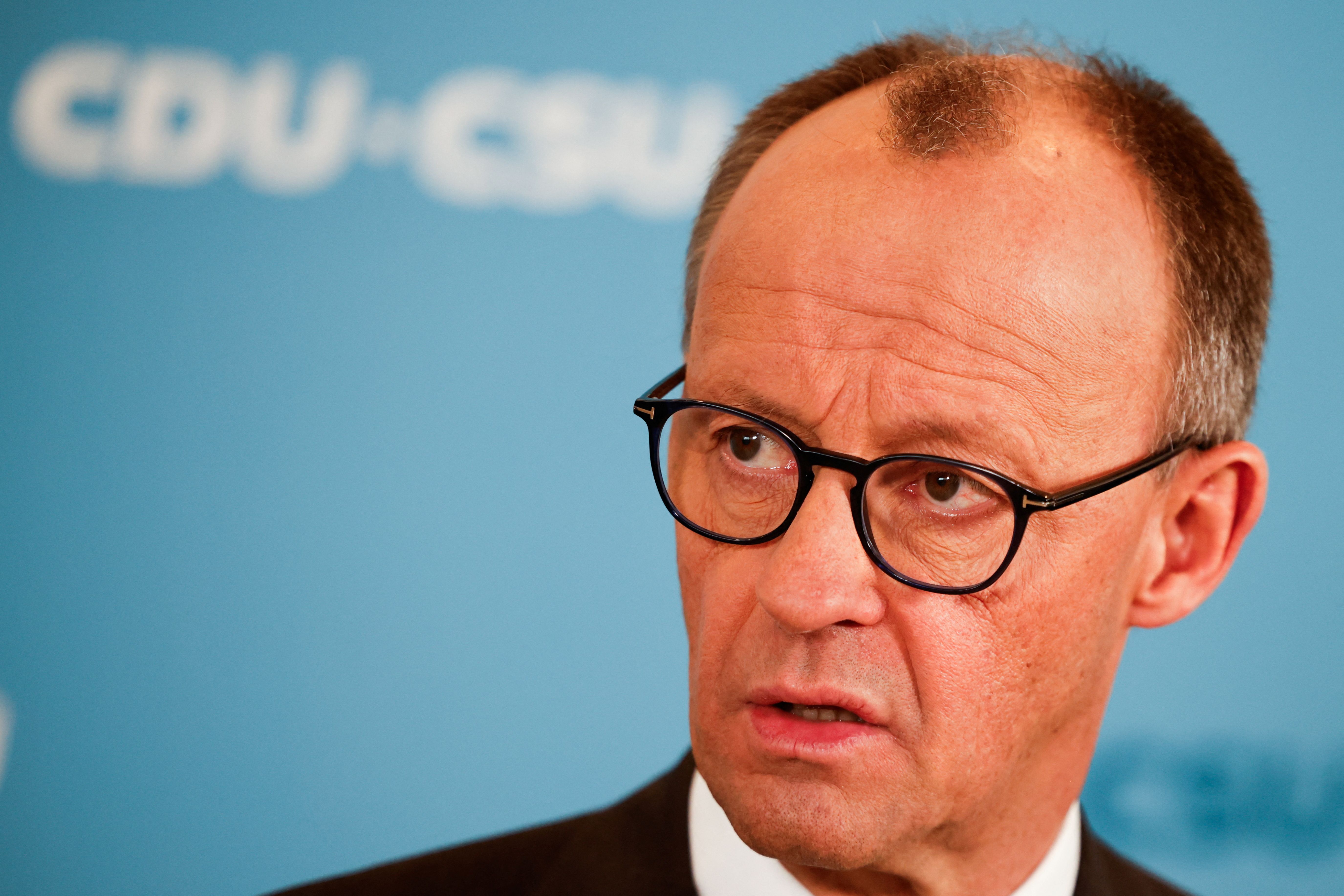 German Chancellor-in-waiting Friedrich Merz attends a press conference after he reached an agreement with the Greens on a massive increase in state borrowing just days ahead of a parliamentary vote next week, in Berlin, Germany, March 14, 2025.