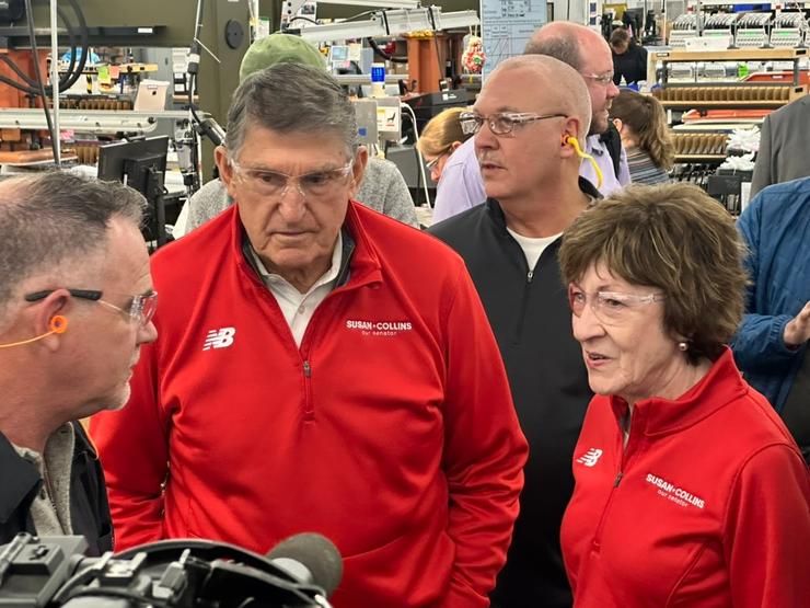 Former Sen. Joe Manchin of West Virginia and Sen. Susan Collins of Maine visit a New Balance factory.