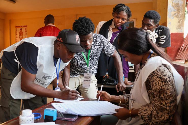 Electoral workers count votes during the presidential election.