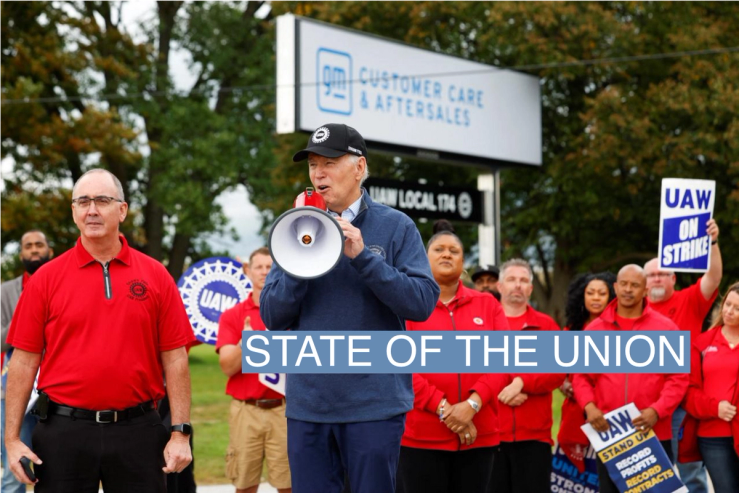 U.S. President Joe Biden speaks next to Shawn Fain, President of the United Auto Workers (UAW), as he joins striking members of the United Auto Workers (UAW) on the picket line outside the GM’s Willow Run Distribution Center, in Bellville, Wayne County, Michigan, U.S., September 26, 2023.