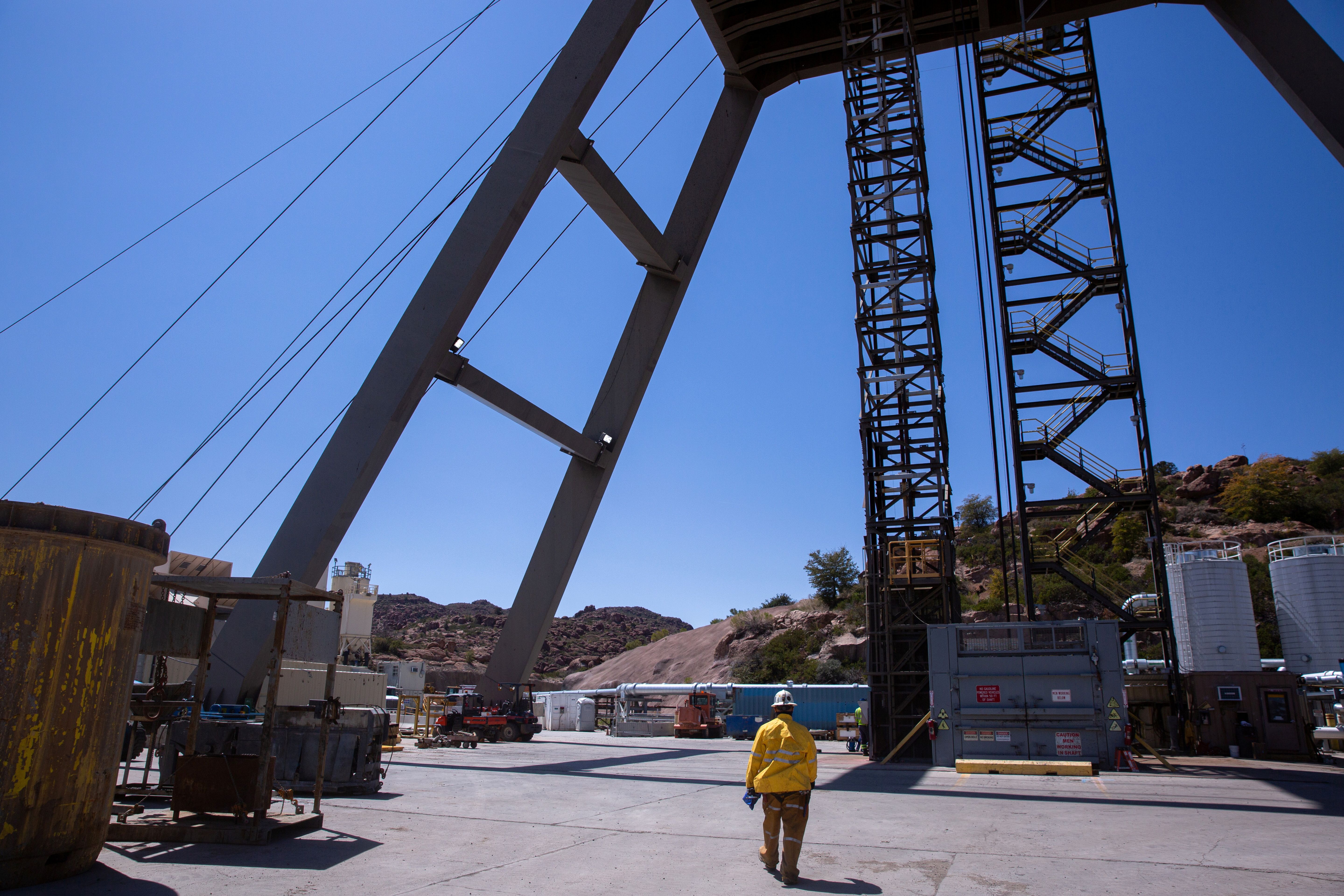 A mine worker walks toward the mine shaft at the Resolution Copper exploratory mine shaft 10 facility in Superior, Arizona