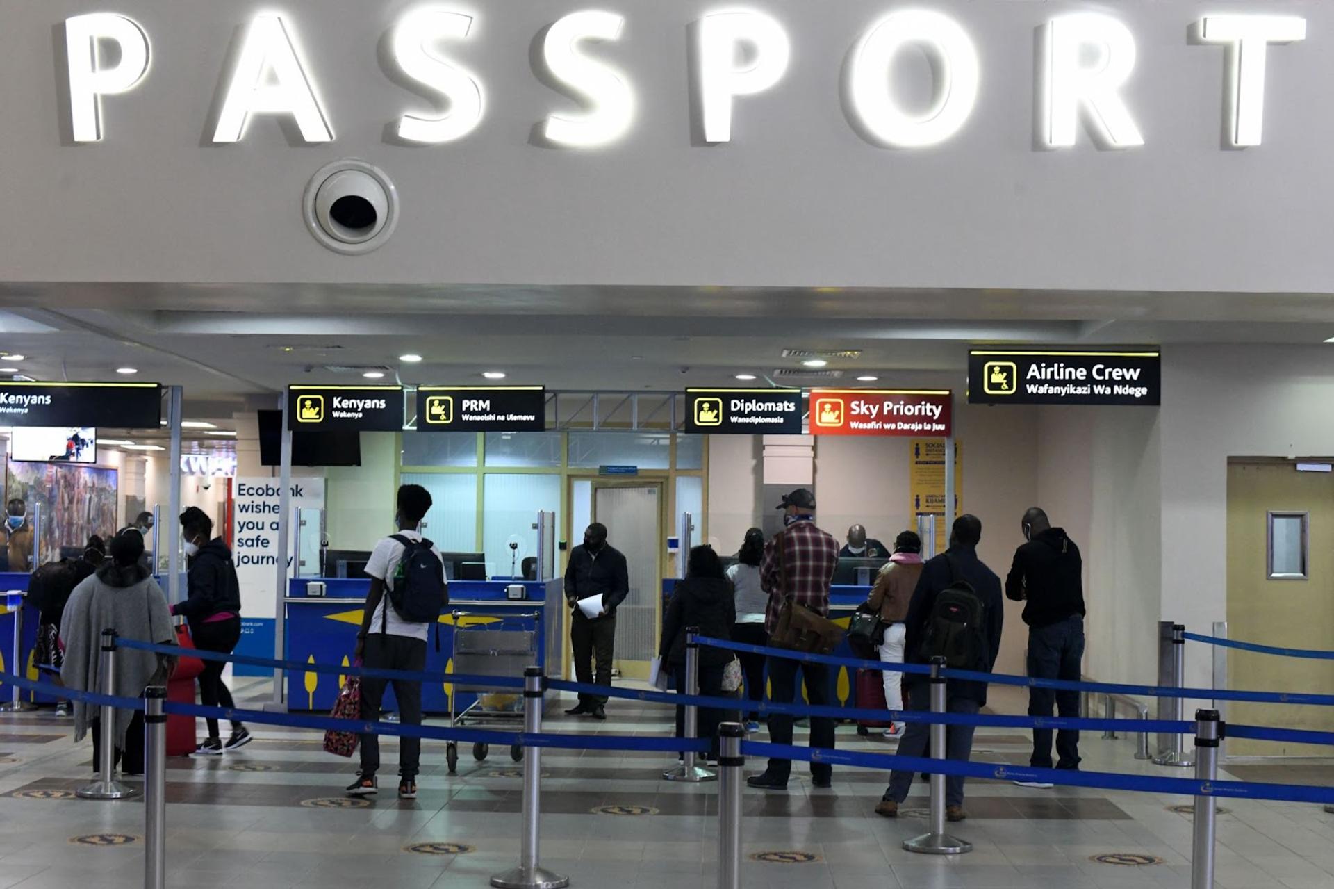 Travellers at passport control